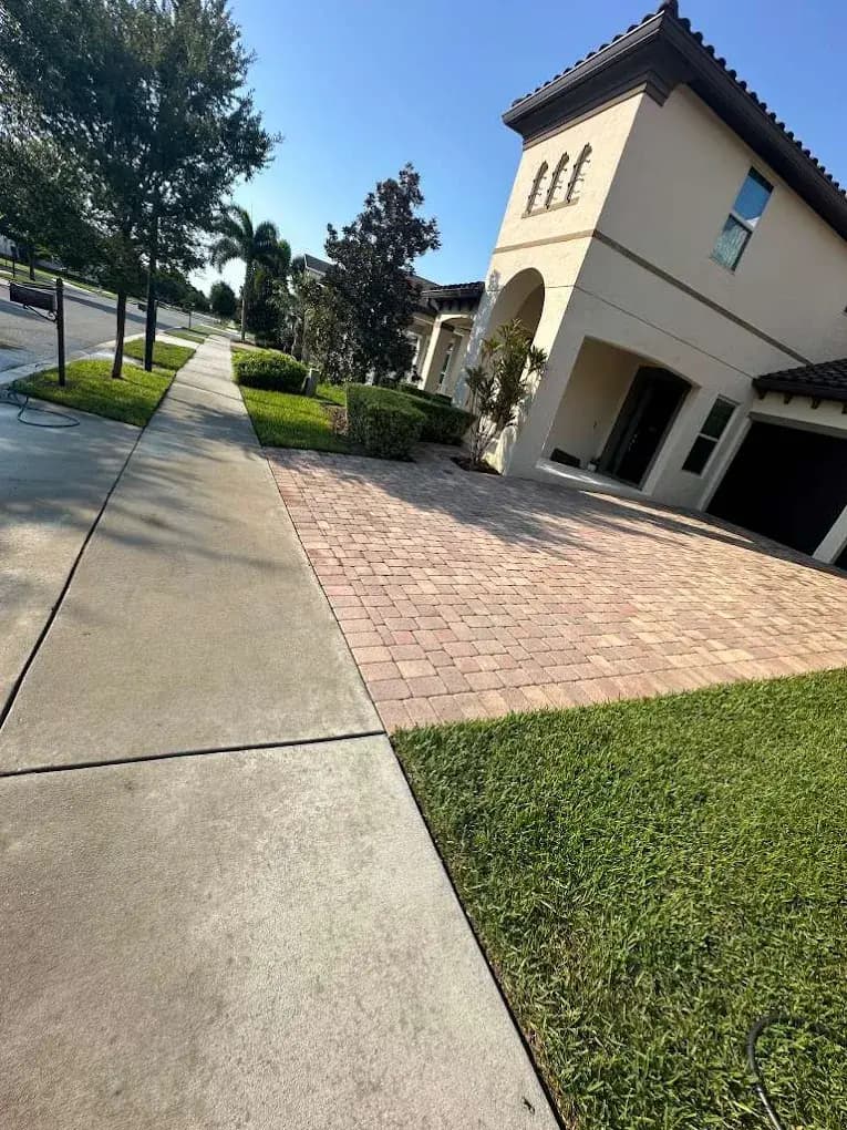 Clean sidewalk and pavers at a Florida home