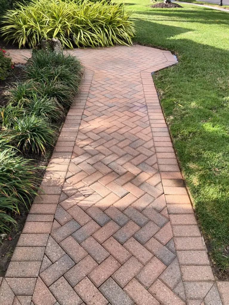 Herringbone paver walkway after cleaning and sealing