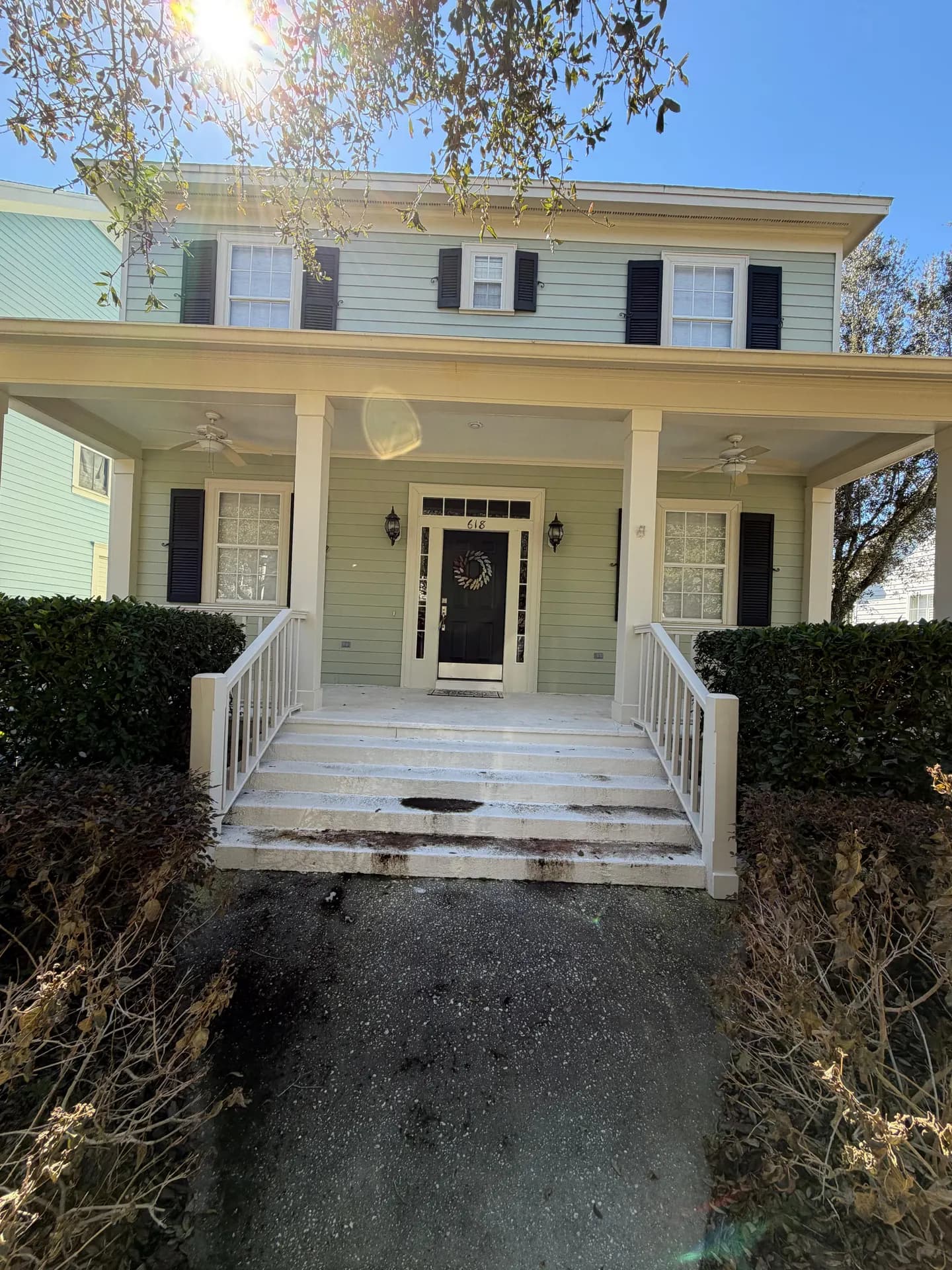 Washed home exterior with brick pavers