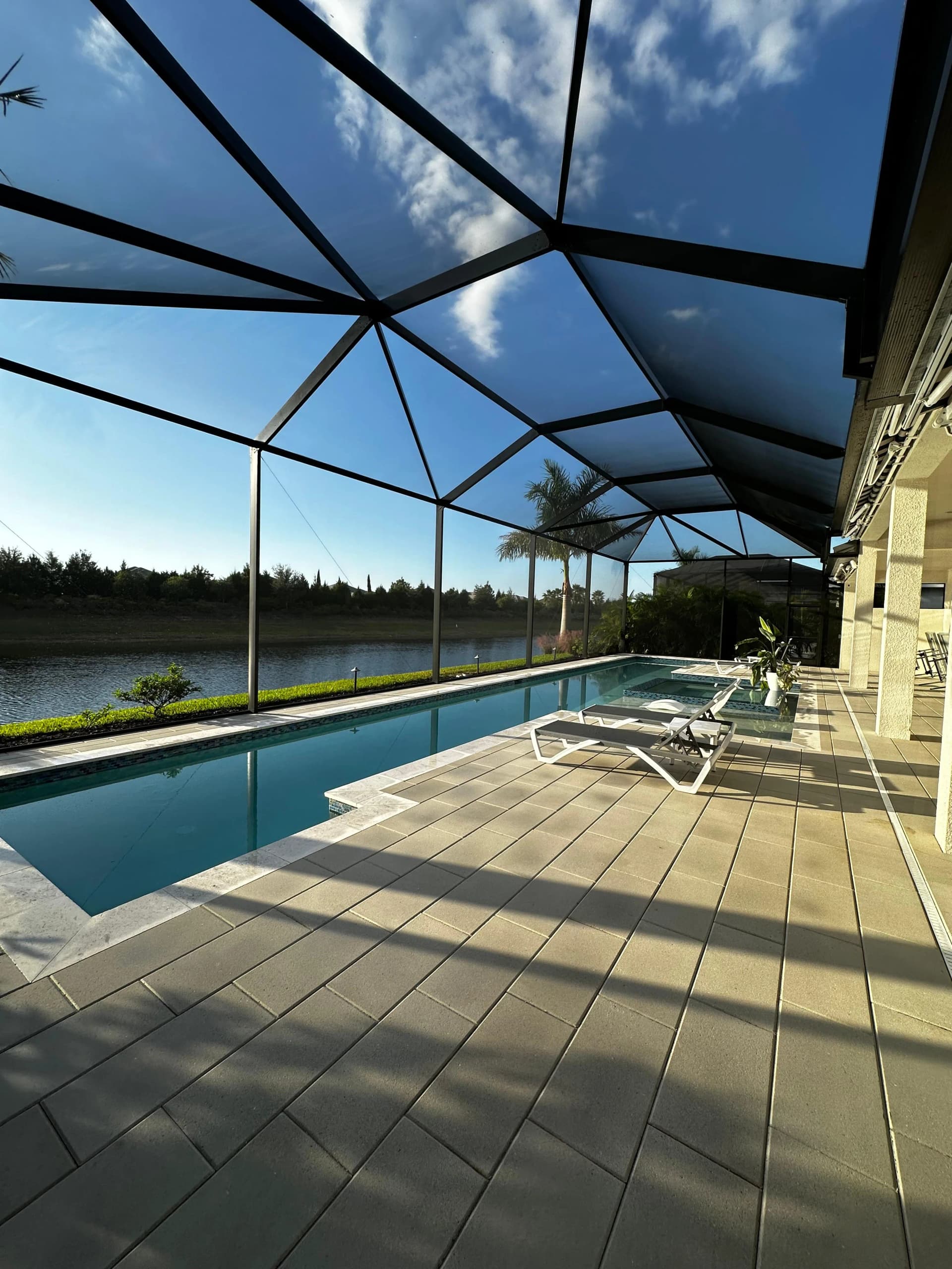 Lakefront pool cage and patio after cleaning