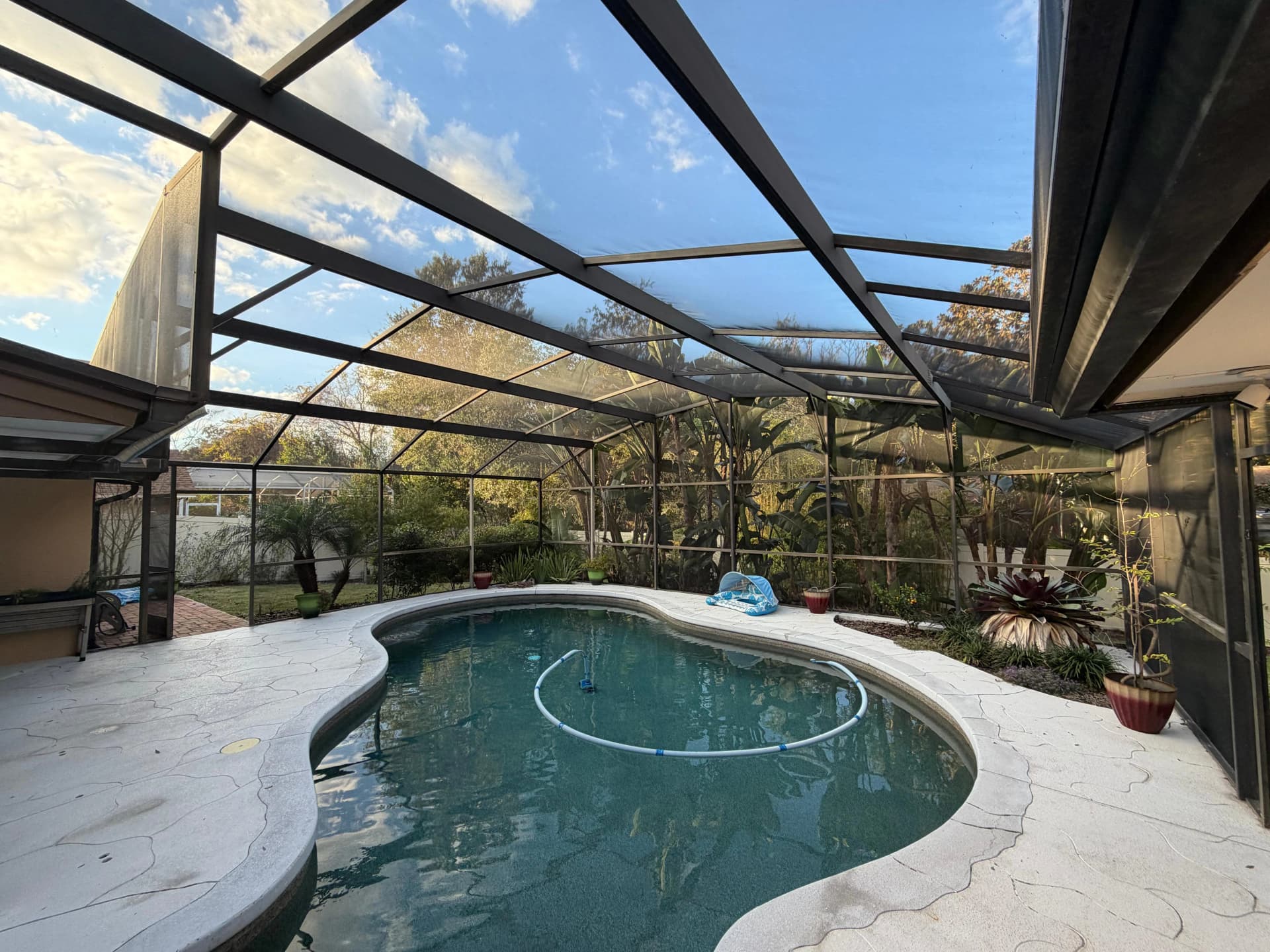 Screen enclosure over a pool after cleaning