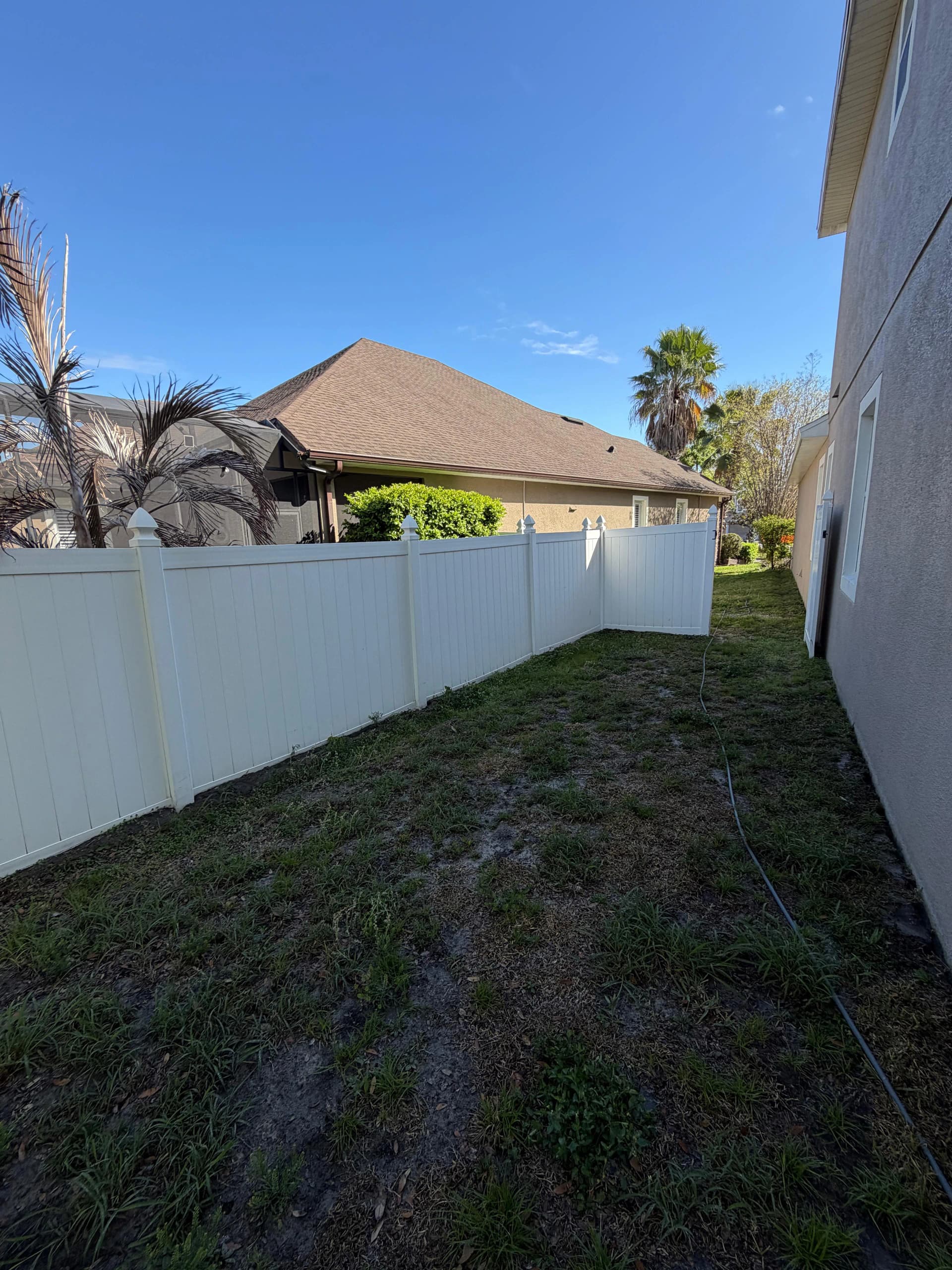 Vinyl fence after pressure washing